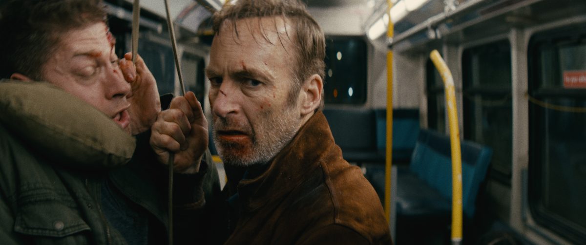(L-R) Bus Pöbler (Alain Moussi) and Hutch Mansell (Bob Odenkirk) in Nobody