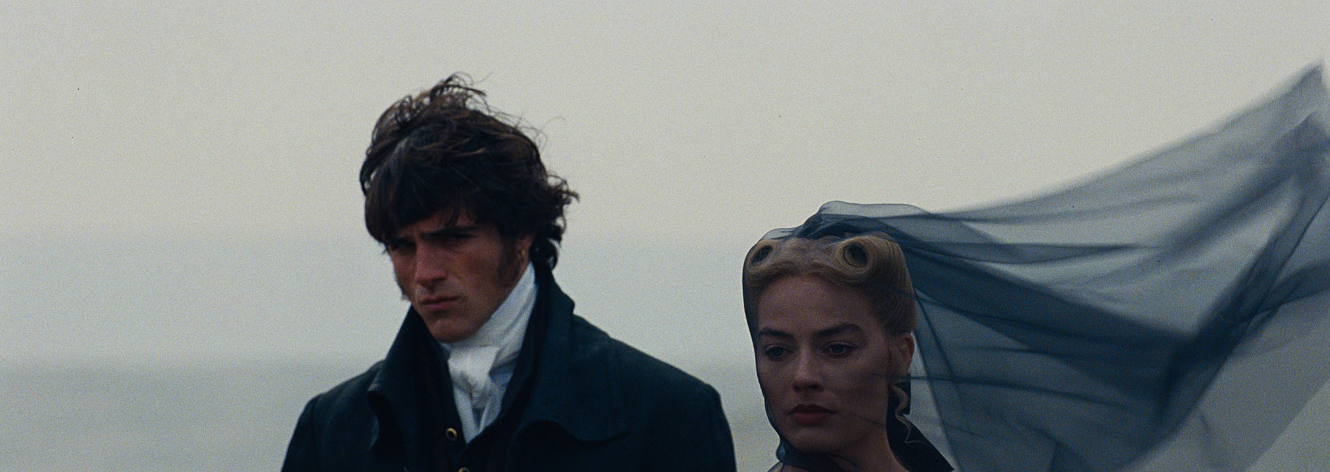(L-r) JACOB ELORDI als Heathcliff and Actor, Producer MARGOT ROBBIE als Catherine Earnshaw in “Wuthering Heights,”